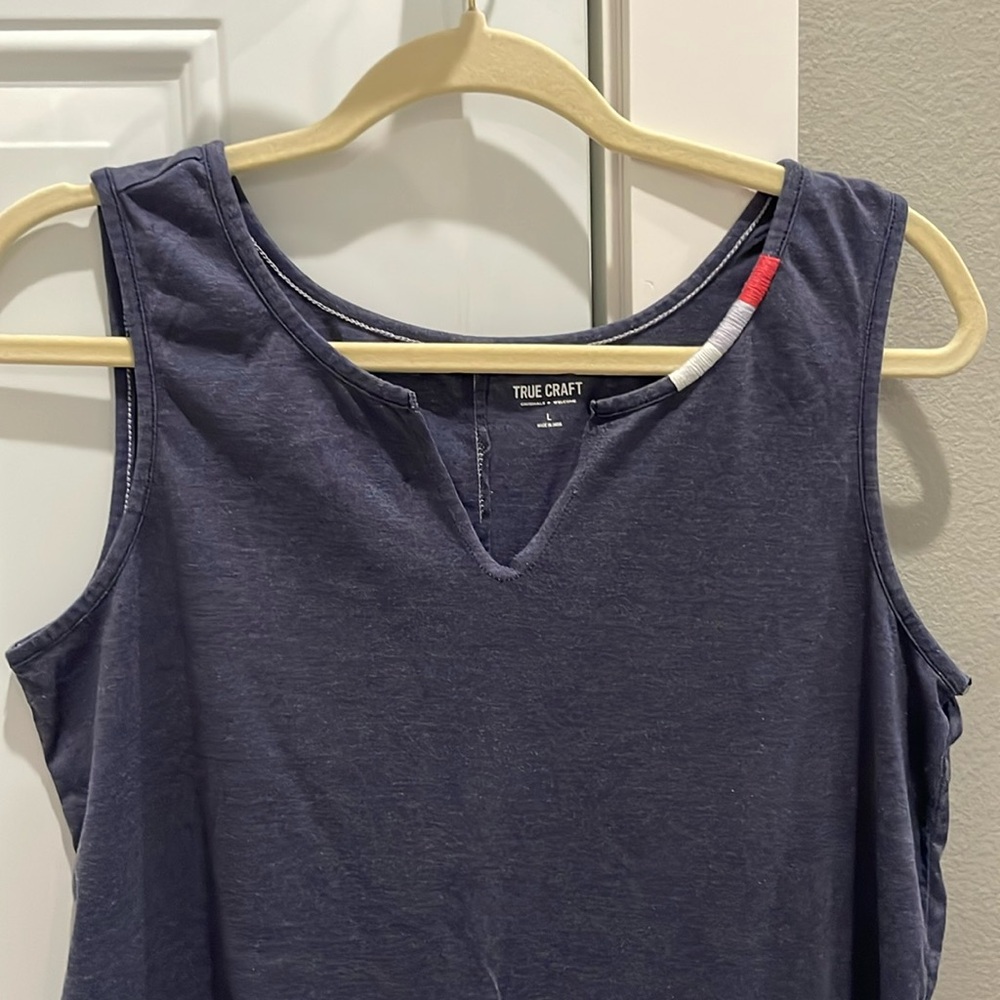 Lightweight blue tank with partially-embroidered neckline